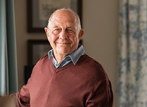 Senior man smiling at home
