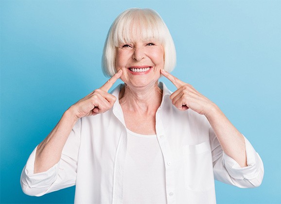 A dentures patient smiling