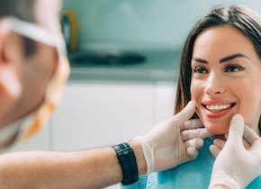 Brooklyn cosmetic dentist looking at patient's smile